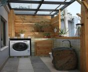 outdoor laundry rooms with wooden element.jpg from open path outdoor washing video