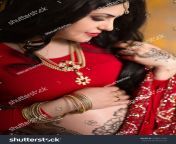stock photo a pregnant indian woman in a red saree mehendi saree india 433671709.jpg from indian saree wifƒâ© pregnant xxnx sex