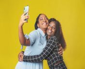 two friends african american girls take selfie video call friends yellow background video chat video conference two 228745989.jpg from የኢትዮጵያ ትልቅ ጀላ sex video com