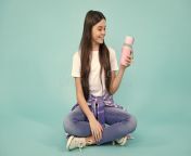 year old girl holds thermos mug hot tea happy teenager positive smiling emotions teen girl year old girl holds 283214015.jpg from @teen