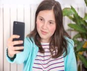 young teen girl making selfie 114982900.jpg from young selfie twens