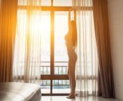 young woman stood window morning waking up to admire view atmosphere resort had rested all night 260588474.jpg from view full screen young hot smooching navel kiss romance in khet mp4