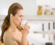 young woman drinking milk modern kitchen 29191135.jpg from woman bobe milk