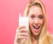 happy young woman drinking milk solid background happy young woman drinking glass milk solid background 115469829.jpg from woman milkdrinkvideo
