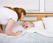 mother putting talkative son to bed bedtime 6602899.jpg from sleep mom share bed son sex vedio