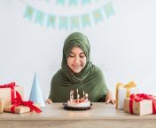 positive muslim teen girl hijab celebrating birthday sitting table cake candles gift boxes positive muslim teen 226223591.jpg from မယ်လိုဒီ လိုးကားn muslim teen girl sex