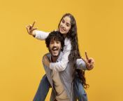 romantic indian couple having fun together showing v sign gesture happy millennial guy piggybacking his girlfriend joyful lady 239103117.jpg from desi lovers having fun in public place full