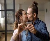 sweet romantic young couple celebrating moving new house apartment flat kissing lips joy happy married renters tenants 236705475.jpg from flat kiss