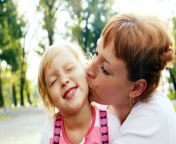 affectionate mom kissing her little daughter happy laughing 56222489.jpg from mom kisses daughter