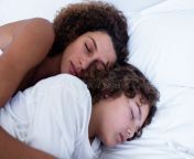 close up mother son sleeping together bed 68289764.jpg from sleeping mother son