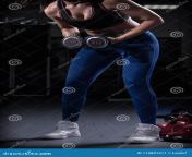 woman bodybuilder lifting weight gym isolated over black background woman bodybuilder lifting dummbells isolated over black 115891311.jpg from 231007　bodybuilder　woman