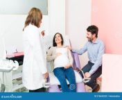 gynecologist talking female patient her husband health their baby pregnant women her partner listening 210643203.jpg from female doctor sex