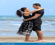 happy interracial couple beach romantic young looking to each other smiling asian woman caucasian man 69604982.jpg from interracial beach