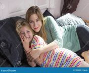 little girl mom together happy mother daughter cuddling bed 78086806.jpg from mom and small bxx 0ld wap sex