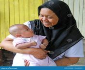 mother baby outisde her house hulu langat selangor malaysia 83936568.jpg from melayu mom