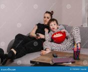 mom son watch tv eat popcorn couch happy mom son resting playing sofa their free time 178228460.jpg from wacth free mom son