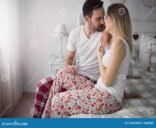 picture young attractive couple kissing their bed picture young attractive couple kissing bed 155929859.jpg from boygirl on bedroom romantic sex