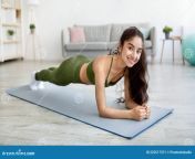 stay home fitness strong indian woman doing whole body workout standing elbow plank pose indoors panorama stay home 222517371.jpg from indian wife taking a whole fist in her chut