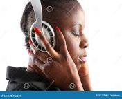 black woman listening to music headphones 18122894.jpg from ebony listening