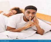 cheating african husband talking privately cellphone family bed hiding his sleeping wife 162177757.jpg from cheating on phone talking to my 18 old girlfriend getting head from sum man’s wife n his bed