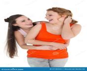 cheerful young female embracing her friend behind over white background 37189935.jpg from 18 old jennifer embraces her slutty
