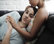 portrait of woman relaxing on girlfriends chest at home cavf54578.jpg from lesbian chestsitting