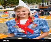 pretty smiling girl in traditional dutch costume gouda cheese market south holland netherlands europe tbmh7g.jpg from dutch