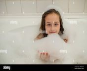 young girl inside the bath a little girl bathes in a bathtub with foam a girl of 9 years old takes a bath purity concept 2ab873w.jpg from ♥breastfeeding ♥ ✔after he takes a bath