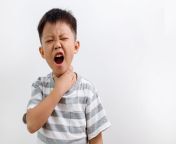 little asian boy holding his neck in pain sore throat.jpg from chock neck