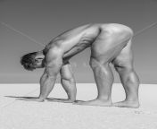 nude man bending down on sand.jpg from naked at the bending