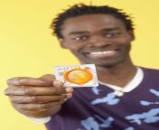 young man holding condom 78621175 5bf8639fc9e77c0058dbdb52.jpg from men cock condom using