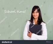 stock photo beautiful young indian school teacher standing in front of blackboard 31685311.jpg from indian young school teacher self