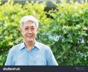 stock photo headshot of happy old mature asian with white grey hair man wearing blue shirt smiling positive and 1419055517.jpg from asian grandpa