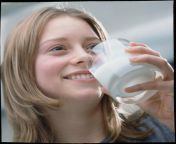 teenage girl drinking a glass of milk damien lovegrove.jpg from grilmilk