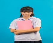 asian student with long hair girl holding notebook blue 1150 19015.jpg from asian 18 school