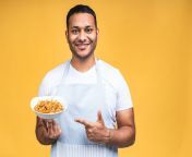 portrait happy african american indian black man chef cooking pasta cooking profession haute cuisine food people concept isolated yellow background 255757 8998.jpg from black cook indian