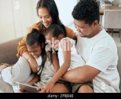 tablet relax and asian family with children on sofa watching a movie online together mom dad and girls bond and playing at home using digital note 2prj04b.jpg from full movies aisan mom dad xxx sister sleep