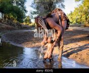 himba woman bathing her baby in a river r5eh5j.jpg from himba twerkdian village outdoor bathing xxx video
