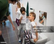 preschool children with teacher brushing their teeth indoors at nursery bathroom jpgs612x612wgik20cwa9ukaewxeynma88s1xav9dpoqi 2mnye 504zm6tk0 from wc teacher