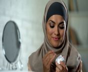 smiling muslim lady applying moisturizing face cream skin care cosmetology jpgs640x640k20cvfh8xxdcm2i0ovv2lsi mgnhihr6jy0vyiwfoatidak from muslim hindi video open sexy 14 sana ke star bfgrandpa gay sasur batu wa