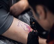 close up photo of a girl tattoo artist putting a tattoo on the arm of a young guy in a tattoo jpgs612x612w0k20chr6dblmhp9owjd84clpjv8vhc6pybi8g5zjezo7ctpy from ลักหลับน้องสาวexy teacher girl tattoo xx