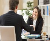 smiling young woman shaking a mans hand gettyim original.jpg from get a job