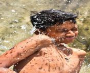 around water splash hit indian little boy face dg00110519.jpg from photosk