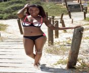 59966977 african woman in her beach wear walking along the wooden walkway to the beach.jpg from afrika womans sexy