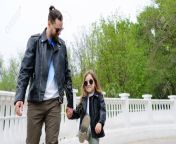 129208911 fashionable stylish family for a walk dad and daughter walking on the viewing platform holding hands.jpg from pore father and daughter