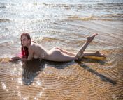105914827 beautiful young woman posing in the sea redhead enjoying summertime at the beach.jpg from sea hot naked com