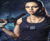 31053608 brutal woman standing on factory ruins and holding handgun.jpg from women of brutal