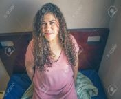 151563716 fat mexican woman with latin appearance with curly hair lying on her bed.jpg from bbw fat mexican