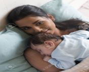 53226635 young mother lying in bed with her baby son sleeping on her chest she is smiling at the camera.jpg from sleeping mom and young son rep xxx video 3g