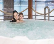68505704 mom and son relax in the tub.jpg from hot tub mom